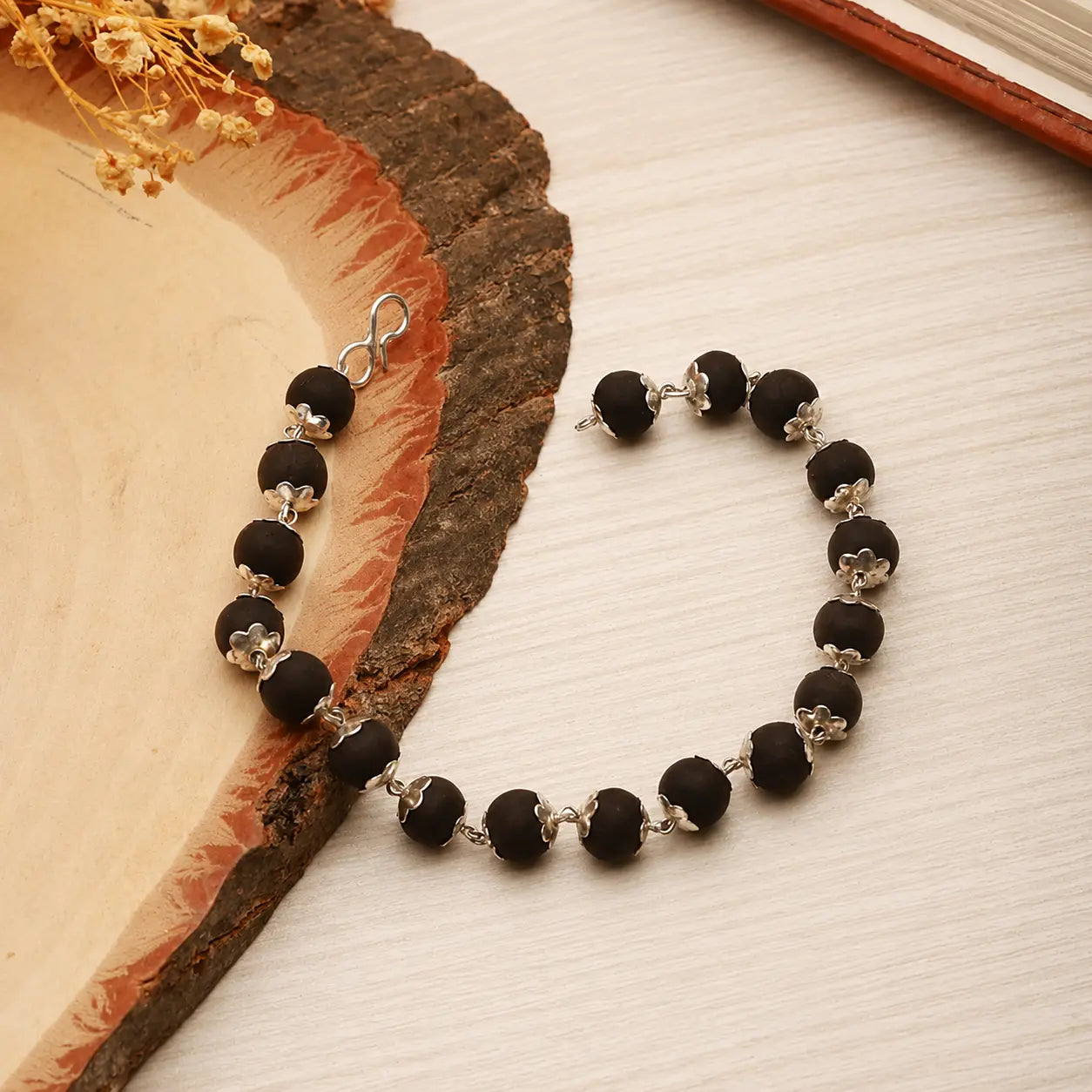 Karungali Beads Bracelet with Silver Plated Floral Caps